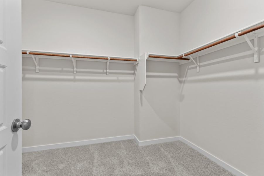 A white room with a white wall and a metal railing. A white room with a white wall and a metal railing.