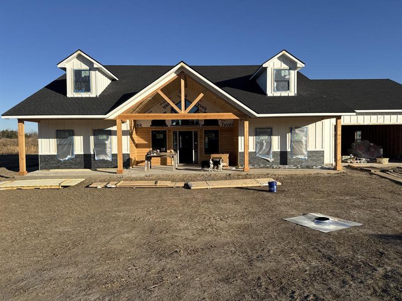 Paint is coming along! White paint, black rock and cedar trim. Paint is coming along! White paint, black rock and cedar trim.