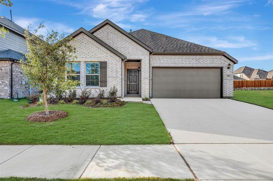 Front exterior of a new home in Sagebrook, Argyle, TX, highlighting curb appeal (Image 2). Front exterior of a new home in Sagebrook, Argyle, TX, highlighting curb appeal (Image 2).