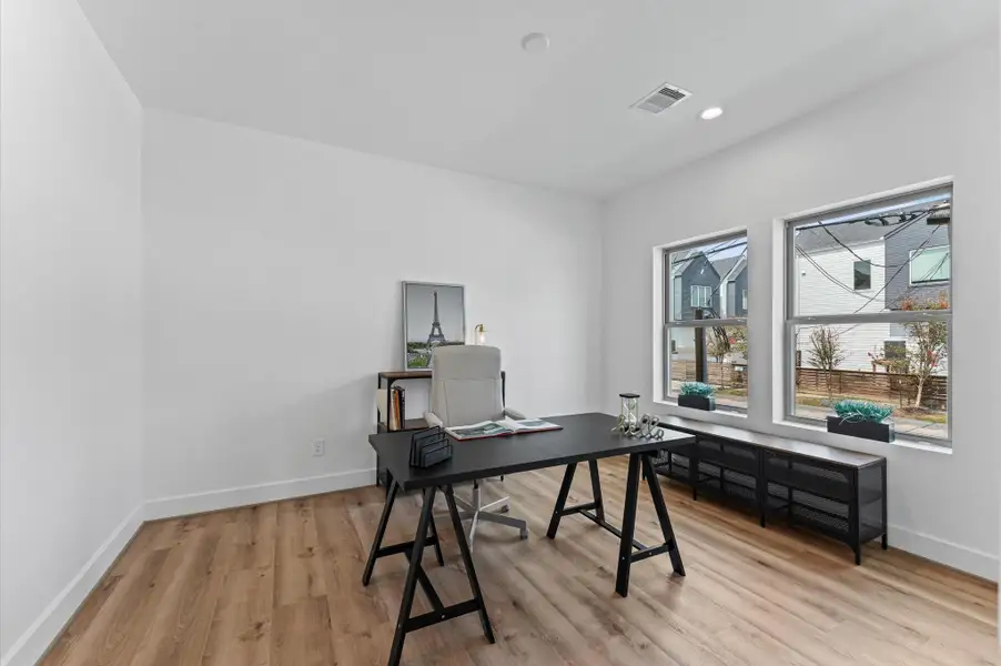 Bedroom on the first floor. Staged as office to represent multiple uses. Bedroom on the first floor. Staged as office to represent multiple uses.