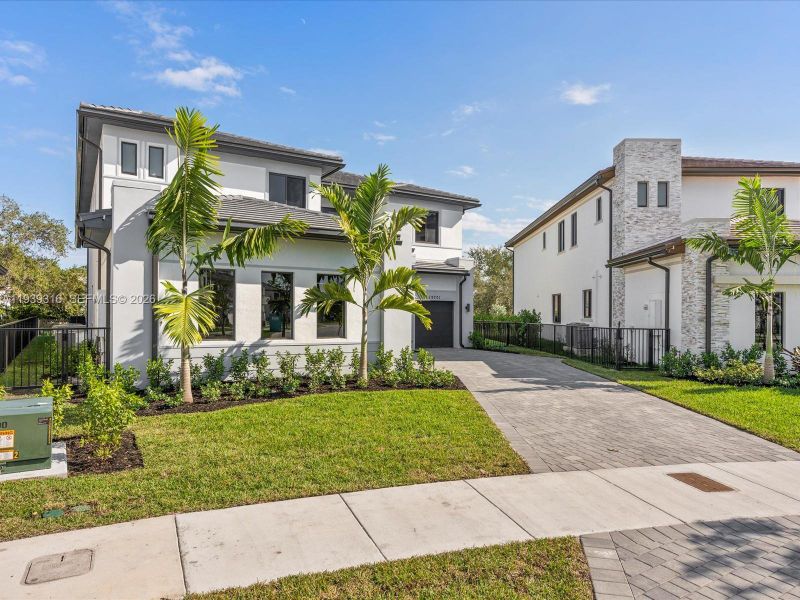 Front exterior of a new home in , Miami, FL, highlighting curb appeal (Image 27).