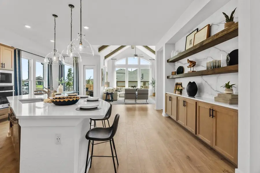 Representative furnished interior of a home built from the Mariah by Chesmar Homes in University Heights, Round Rock (Image 4).