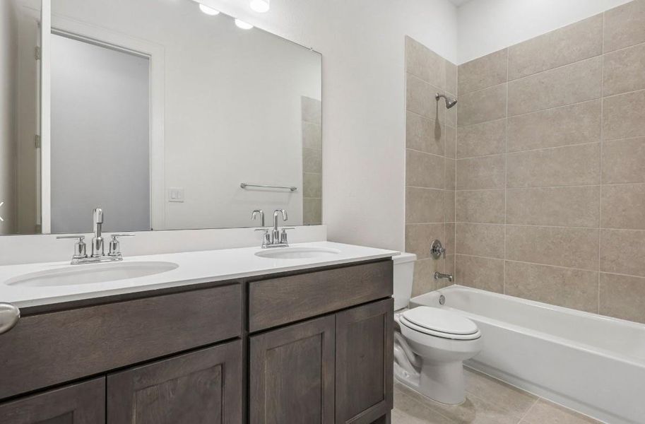 Furnished interior view inside a new home in The Grand Prairie 60', Hockley (Image 4).