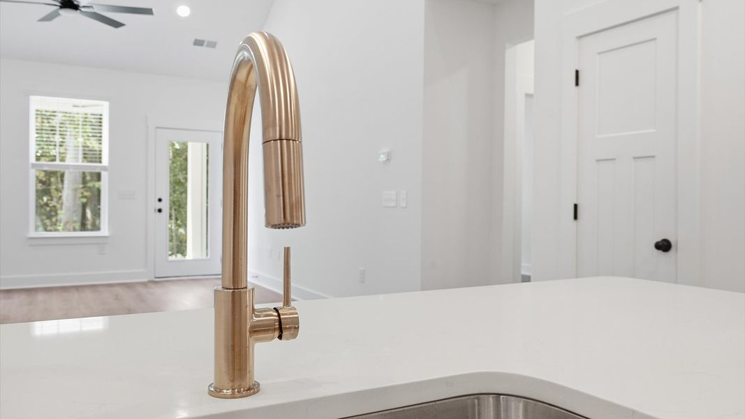 Superior kitchen with quartz countertops, pendant lighting, and a generously sized island near Lake Hartwell Superior kitchen with quartz countertops, pendant lighting, and a generously sized island near Lake Hartwell