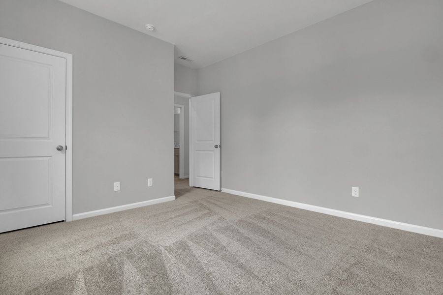 Spacious, unfurnished interior of a new home in Grand Park, Leland (Image 26). Spacious, unfurnished interior of a new home in Grand Park, Leland (Image 26).