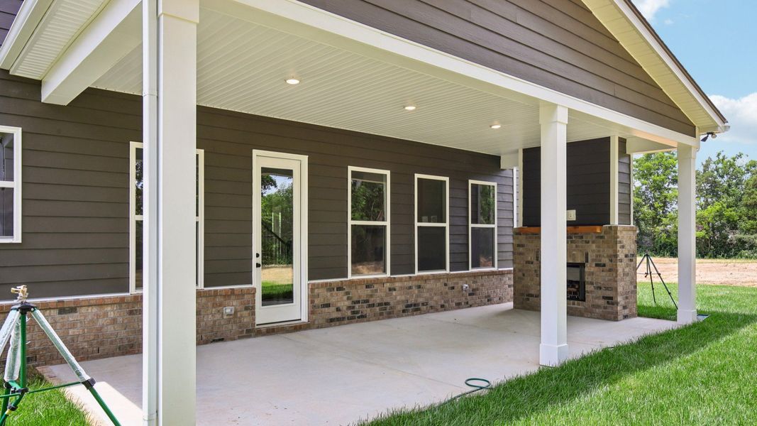 Covered back porch with fireplace Covered back porch with fireplace