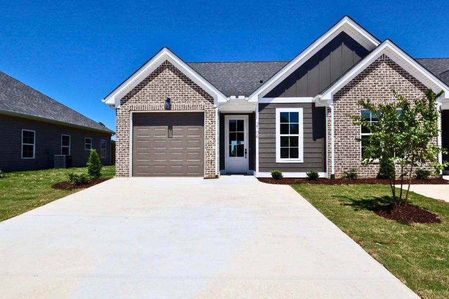 Front exterior of a new home in The Hoback, Cleveland, TN, highlighting curb appeal (Image 2). Front exterior of a new home in The Hoback, Cleveland, TN, highlighting curb appeal (Image 2).