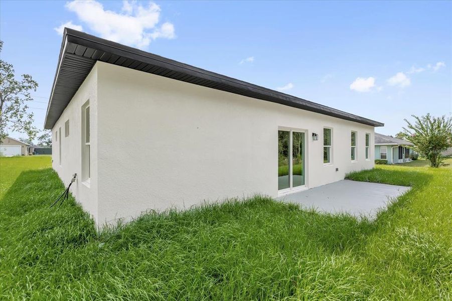 Exterior details and patio area of a home in , Ocala (Image 3).