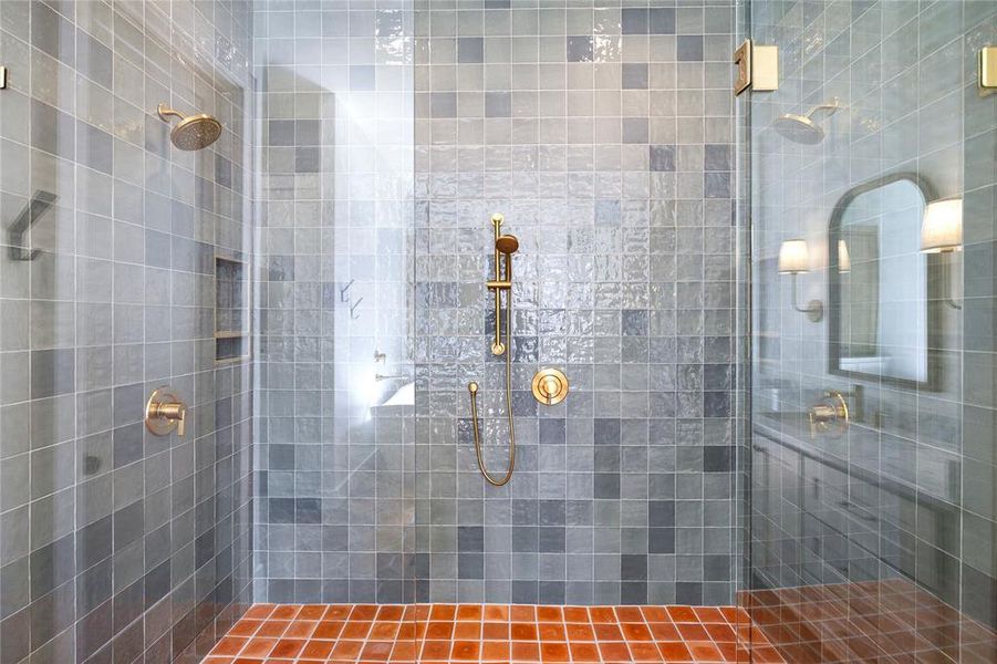 Bathroom featuring a tile shower
