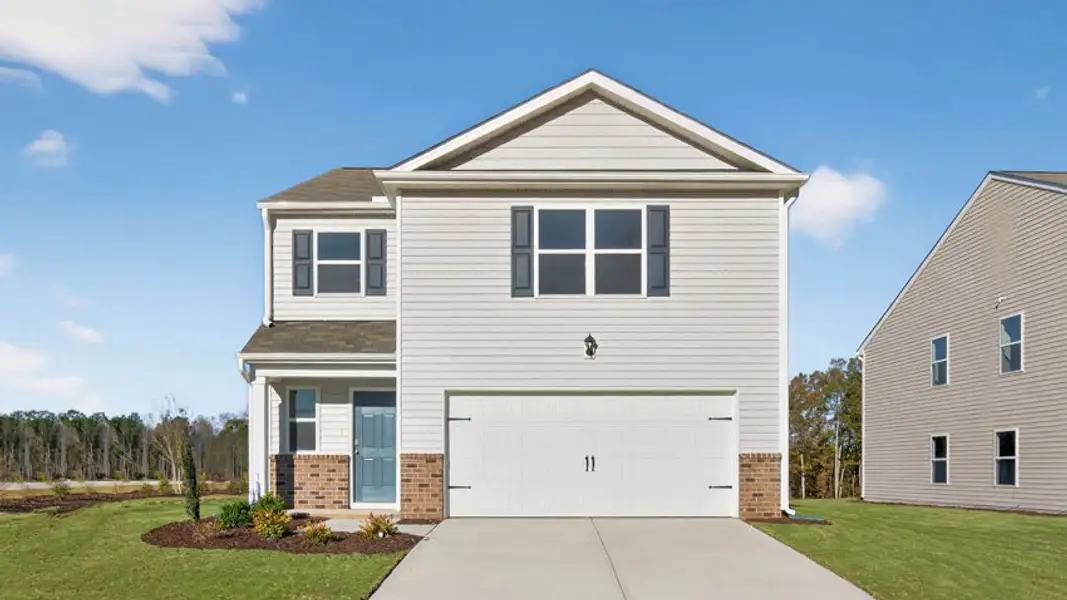 Front exterior of a new home in Wilson's Ridge, Wilson's Mills, NC, highlighting curb appeal (Image 1). Front exterior of a new home in Wilson's Ridge, Wilson's Mills, NC, highlighting curb appeal (Image 1).