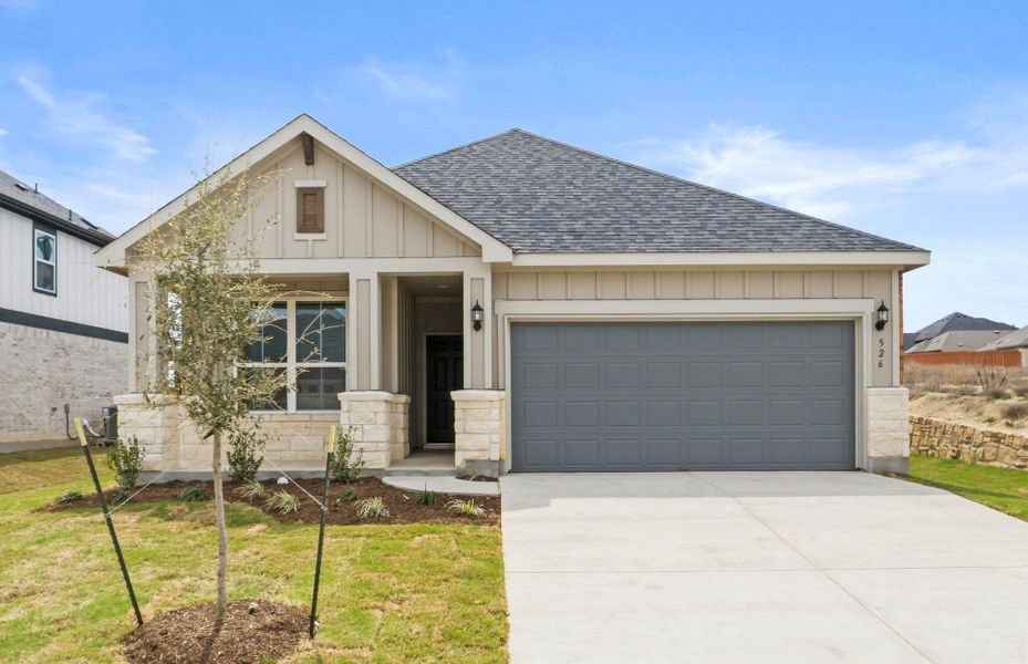 Front exterior of a new home in Sunfield, Buda, TX, highlighting curb appeal (Image 1). Front exterior of a new home in Sunfield, Buda, TX, highlighting curb appeal (Image 1).