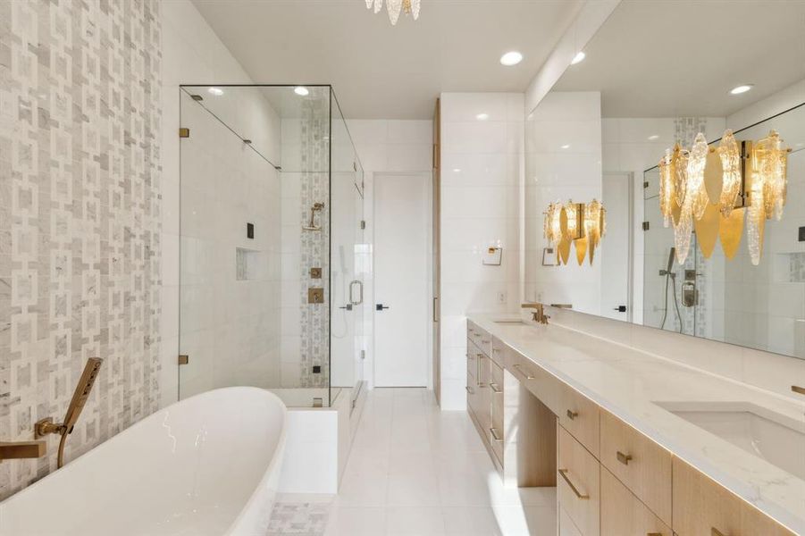 Full bathroom featuring a freestanding tub, a stall shower, double vanity, tile patterned flooring, and recessed lighting