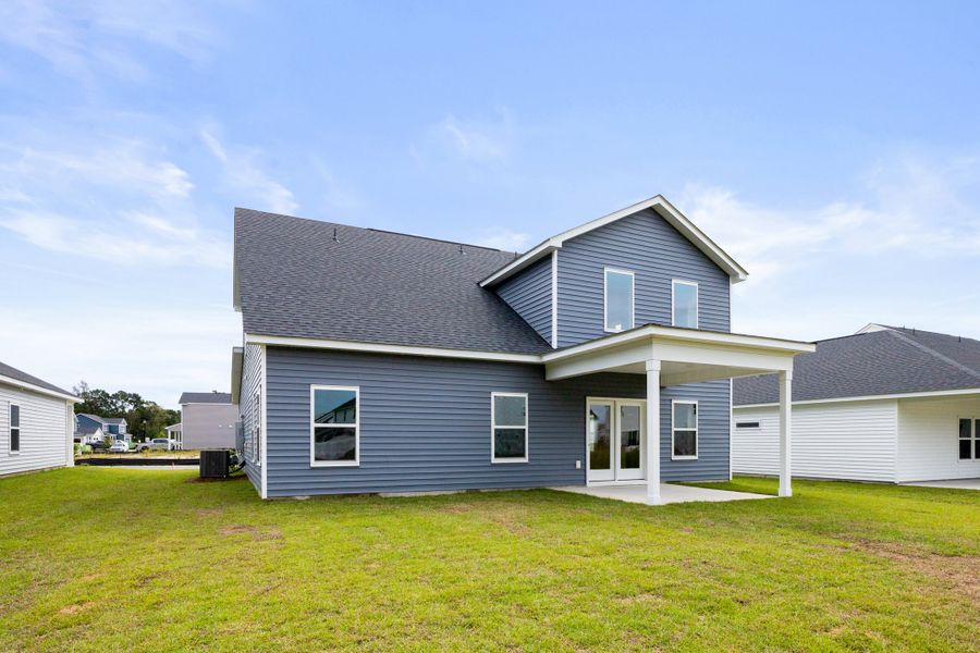 Representative exterior photo of a completed home built from the Harrison by Ashton Woods in Trieste at Bella Vita, Myrtle Beach, SC (Image 18). Representative exterior photo of a completed home built from the Harrison by Ashton Woods in Trieste at Bella Vita, Myrtle Beach, SC (Image 18).
