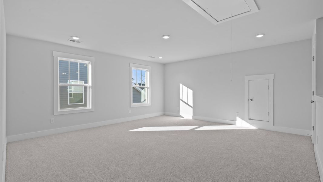 Superior game room space with soft carpet, ideal for work, relaxation, or entertainment