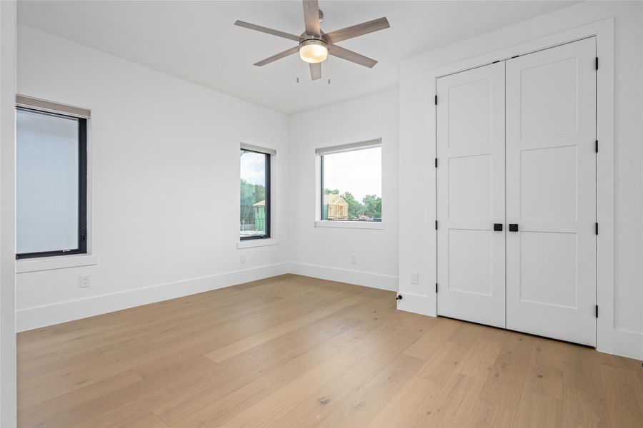 The fourth bedroom is generously sized and features a custom closet for storage ease The fourth bedroom is generously sized and features a custom closet for storage ease