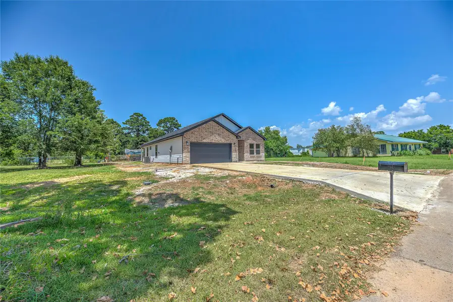Front exterior of a new home in , Livingston, TX, highlighting curb appeal (Image 17). Front exterior of a new home in , Livingston, TX, highlighting curb appeal (Image 17).