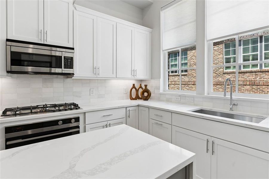 Image of model home with similar floorplan.