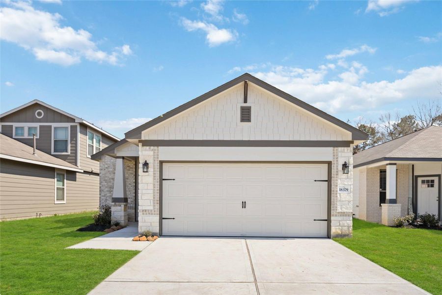 Front exterior of a new home in The Landing, New Caney, TX, highlighting curb appeal (Image 1). Front exterior of a new home in The Landing, New Caney, TX, highlighting curb appeal (Image 1).