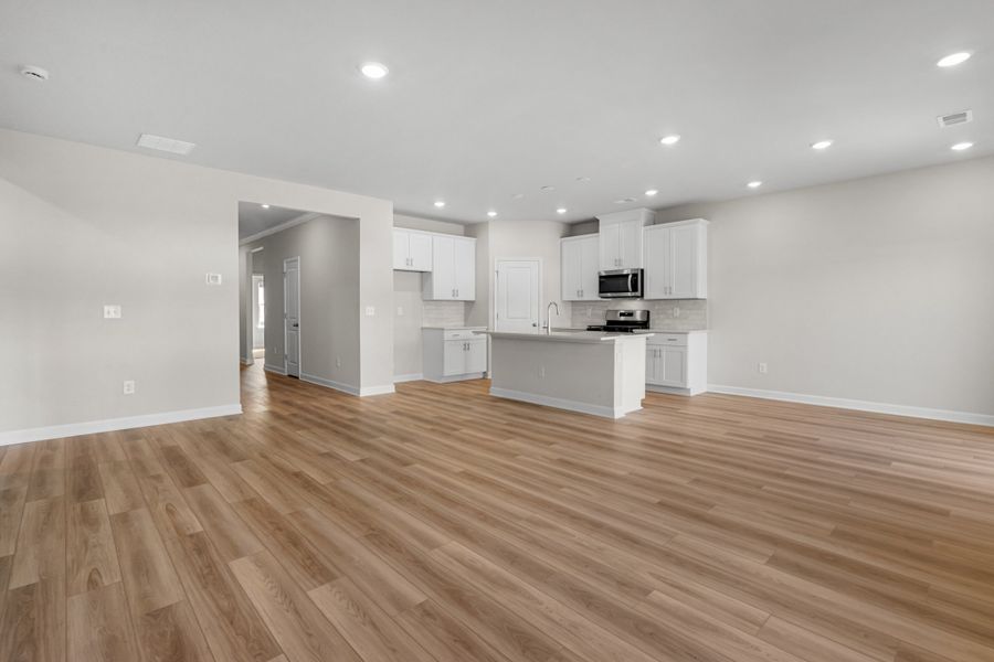 Spacious, unfurnished interior of a new home in Cypress Ridge - The Boardwalk Series, Longs (Image 13).