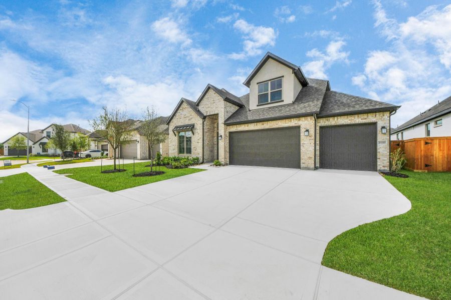 Front exterior of a new home in Marvida, Cypress, TX, highlighting curb appeal (Image 21).