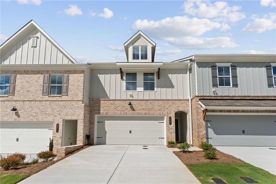 Front exterior of a new home in Wildwood Place, Powder Springs, GA, highlighting curb appeal (Image 2). Front exterior of a new home in Wildwood Place, Powder Springs, GA, highlighting curb appeal (Image 2).