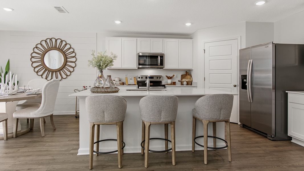 Representative furnished interior of a home built from the HAYDEN II by D.R. Horton in Copes Landing, Jacksonville (Image 9).