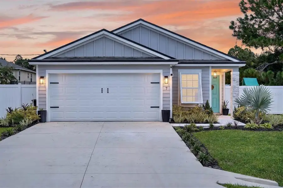Front exterior of a new home in Palm Coast Homesites, Palm Coast, FL, highlighting curb appeal (Image 21).