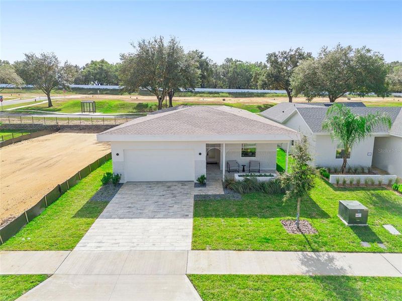 Front exterior of a new home in , Lady Lake, FL, highlighting curb appeal (Image 1). Front exterior of a new home in , Lady Lake, FL, highlighting curb appeal (Image 1).