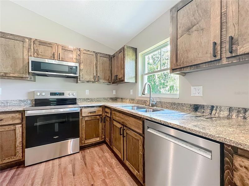 Furnished interior view inside a new home in , Lake Panasoffkee (Image 11).