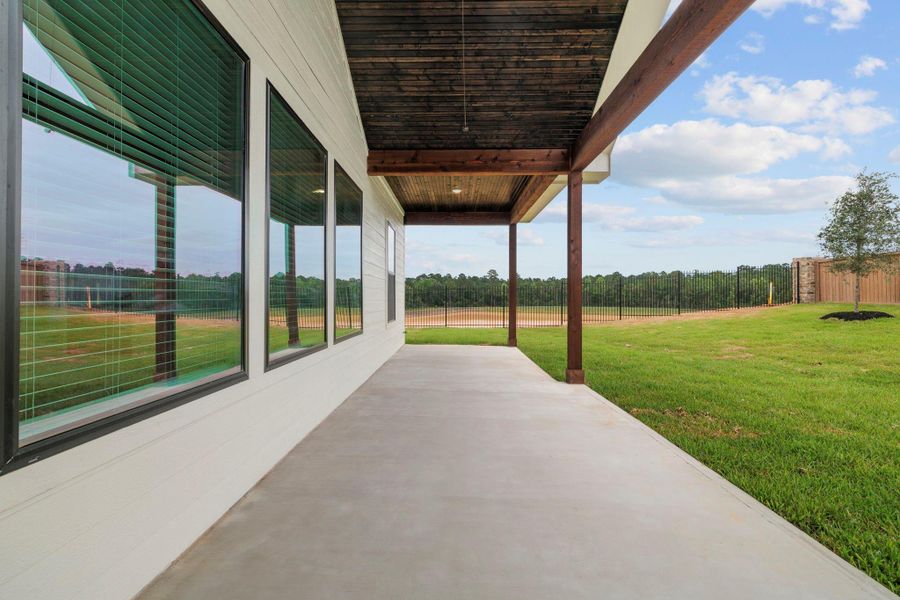 Exterior details and patio area of a home in , Magnolia (Image 21). Exterior details and patio area of a home in , Magnolia (Image 21).