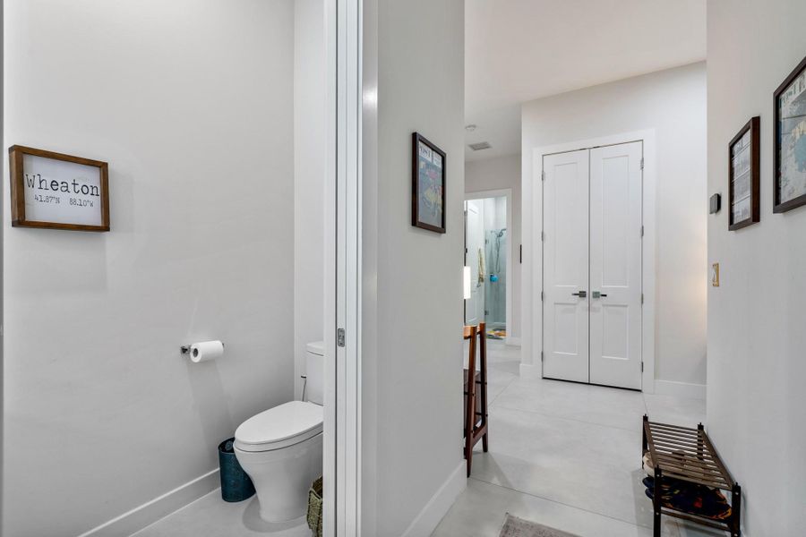 Half bathroom off the laundry room and garage.