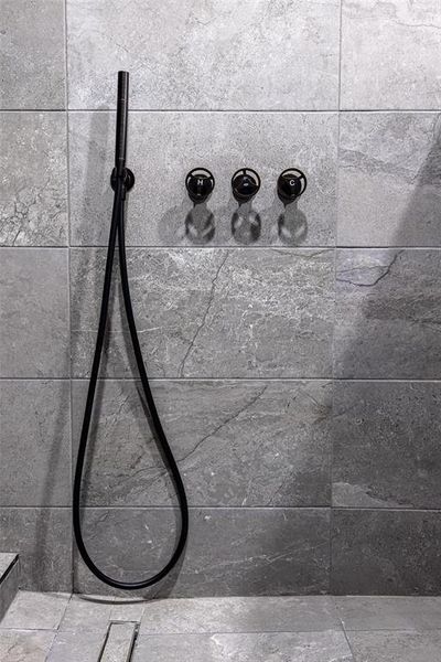 Bathroom view of a tile shower