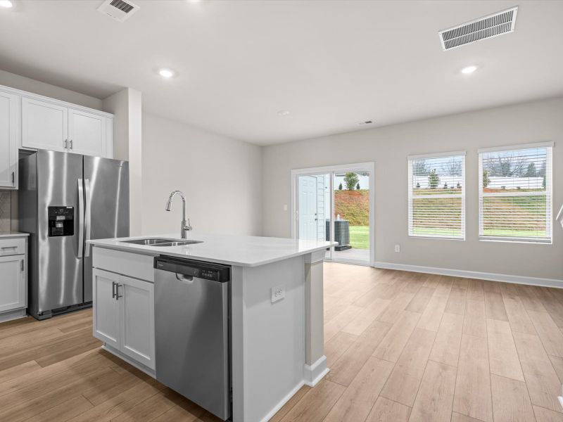 Furnished interior view inside a new home in Crossing at Abner Creek Townes, Greer (Image 7).