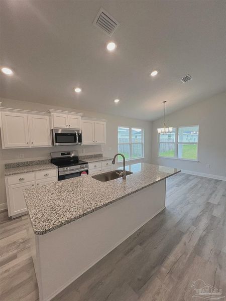 Furnished interior view inside a new home in Pine Top, Cantonment (Image 4).