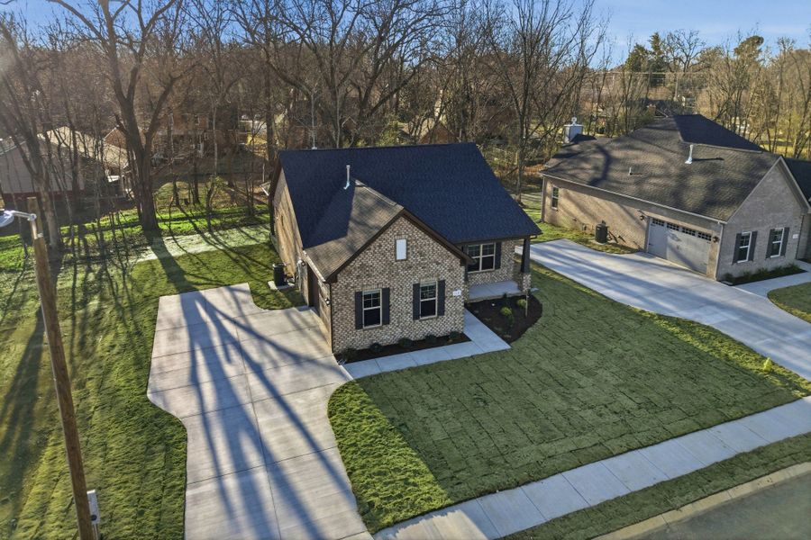 Front exterior of a new home in Sagewood, Tullahoma, TN, highlighting curb appeal (Image 7).