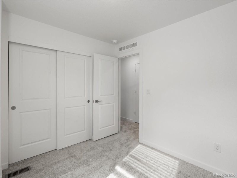 Spacious, unfurnished interior of a new home in The Hub at Virginia Village, Denver (Image 22).