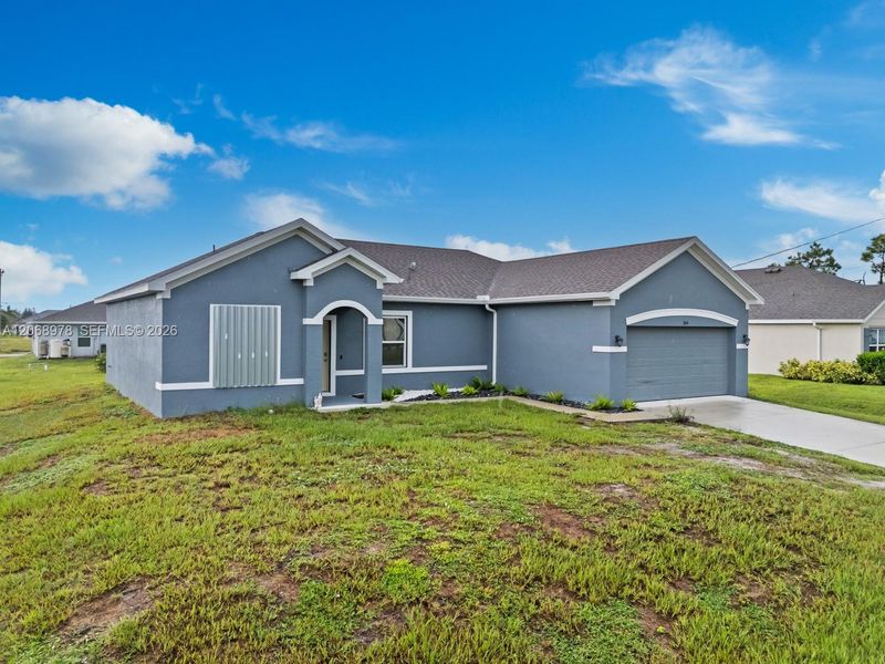 Front exterior of a new home in , Cape Coral, FL, highlighting curb appeal (Image 18).
