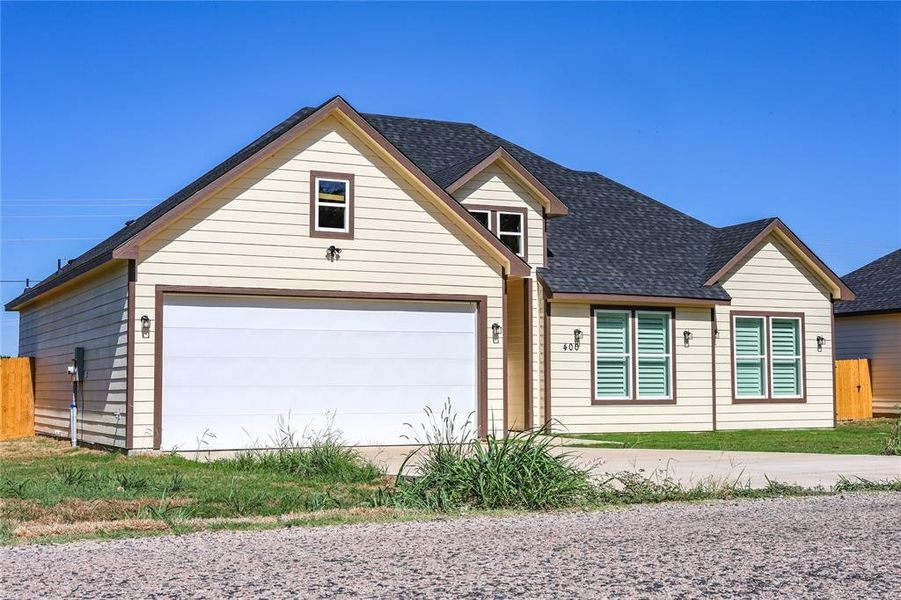 View of front facade featuring roof with shingles View of front facade featuring roof with shingles