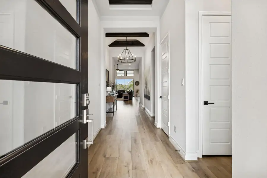 Entry with soaring beam ceilings