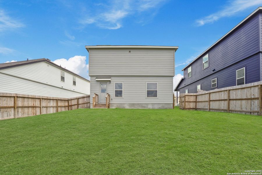 Front exterior of a new home in Cinco Lakes, San Antonio, TX, highlighting curb appeal (Image 24). Front exterior of a new home in Cinco Lakes, San Antonio, TX, highlighting curb appeal (Image 24).