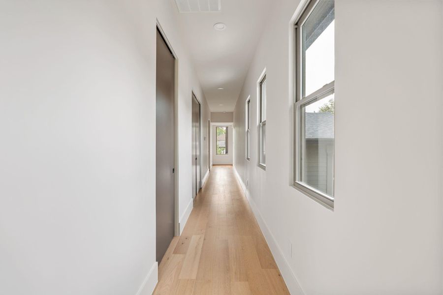 The upstairs gallery provides a seamless connection between the bedrooms, study, and sauna, with capped wiring thoughtfully prepared to accommodate future sconces if desired. The upstairs gallery provides a seamless connection between the bedrooms, study, and sauna, with capped wiring thoughtfully prepared to accommodate future sconces if desired.