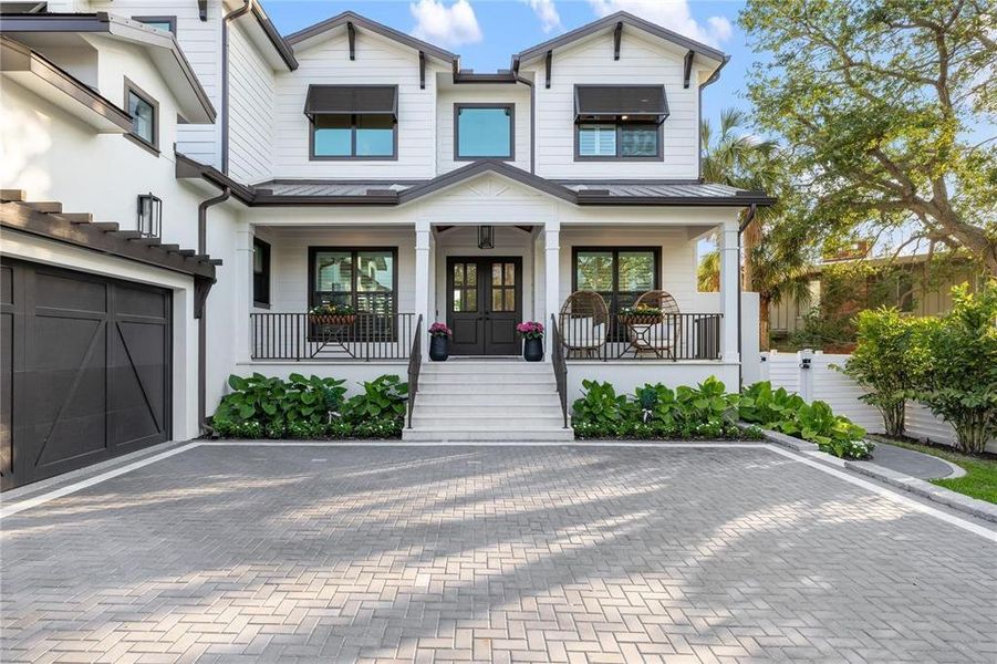 Front exterior of a new home in , Sarasota, FL, highlighting curb appeal (Image 24). Front exterior of a new home in , Sarasota, FL, highlighting curb appeal (Image 24).