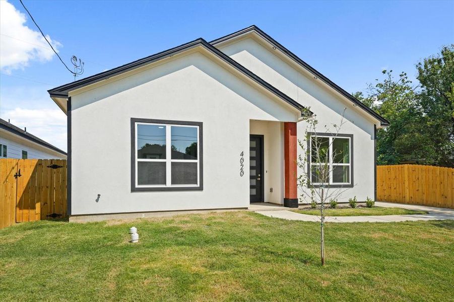 View of front of home featuring stucco siding View of front of home featuring stucco siding