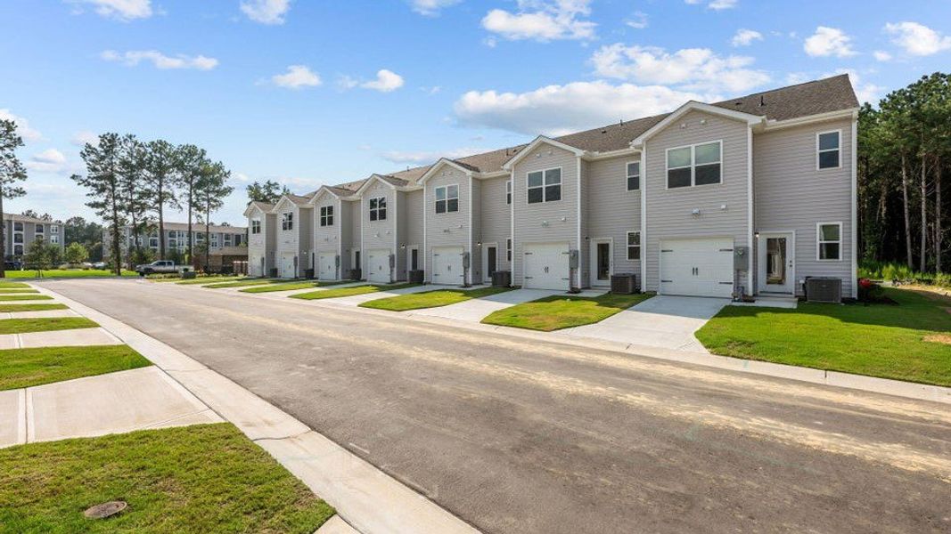 Front exterior of a new home in Clock Road Townhomes, New Bern, NC, highlighting curb appeal (Image 20).