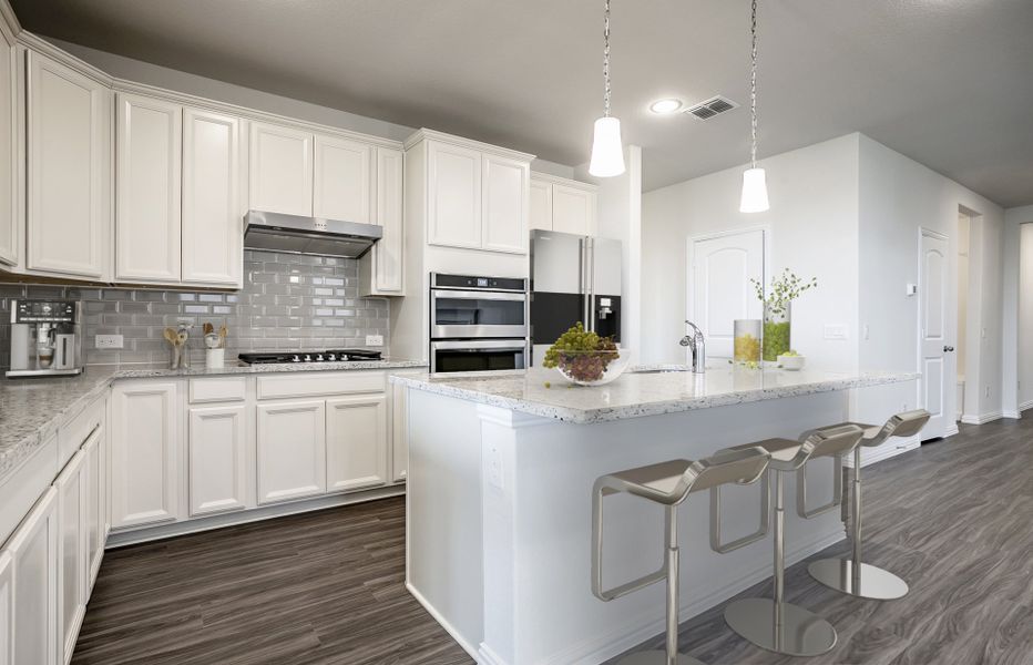 Spacious, island kitchen with eat-in bartop and abundant cabinet space