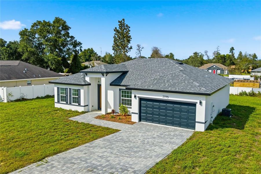 Front exterior of a new home in , Ocala, FL, highlighting curb appeal (Image 2). Front exterior of a new home in , Ocala, FL, highlighting curb appeal (Image 2).