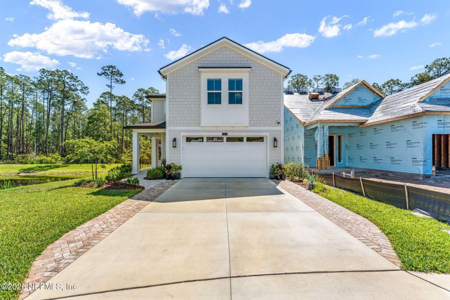 Front exterior of a new home in , Ponte Vedra, FL, highlighting curb appeal (Image 21).