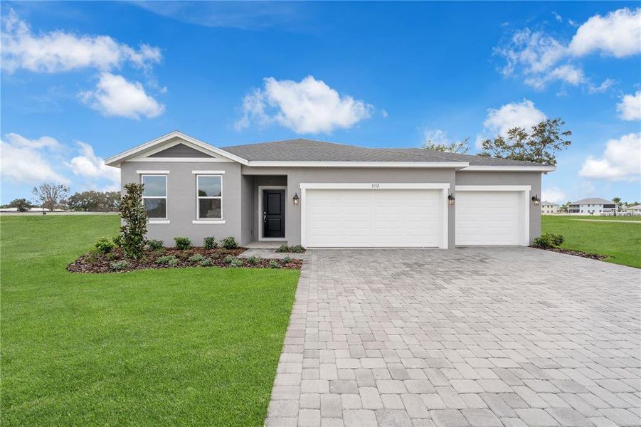 Front exterior of a new home in Country Club Estates, Palm Bay, FL, highlighting curb appeal (Image 2). Front exterior of a new home in Country Club Estates, Palm Bay, FL, highlighting curb appeal (Image 2).