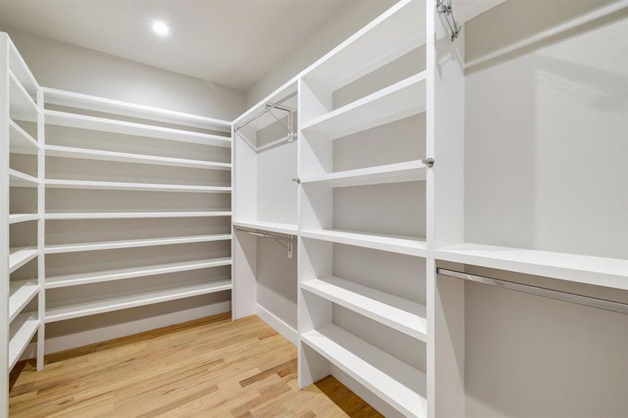 Spacious closet featuring hardwood / wood-style flooring