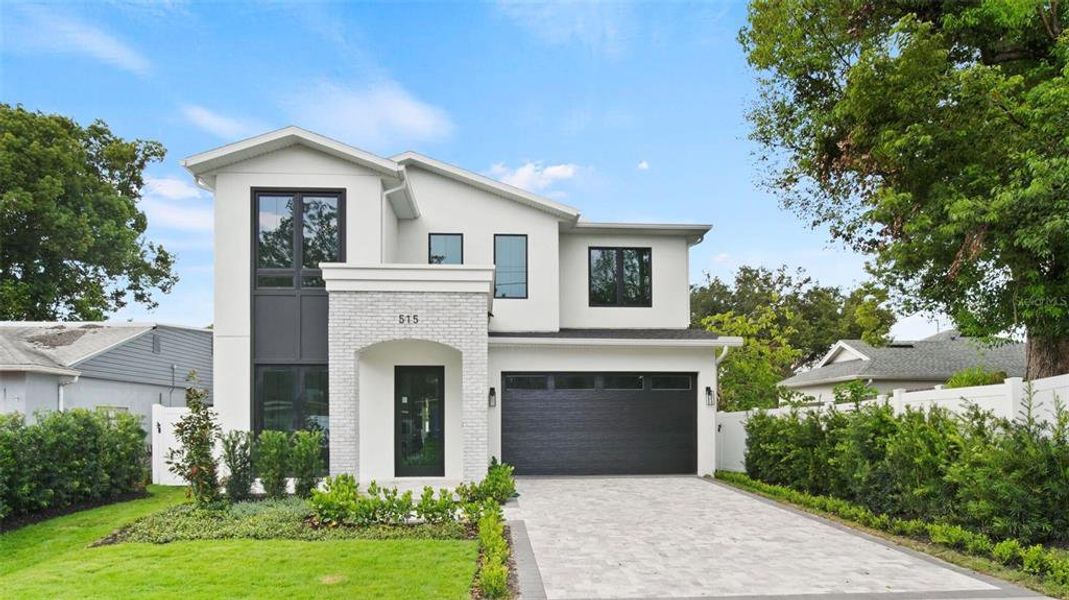 Front exterior of a new home in , Orlando, FL, highlighting curb appeal (Image 25).